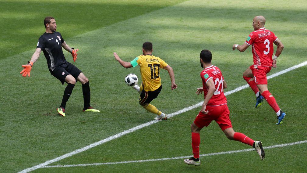 Belgium's Eden Hazard dribbles past the Tunisia goalie