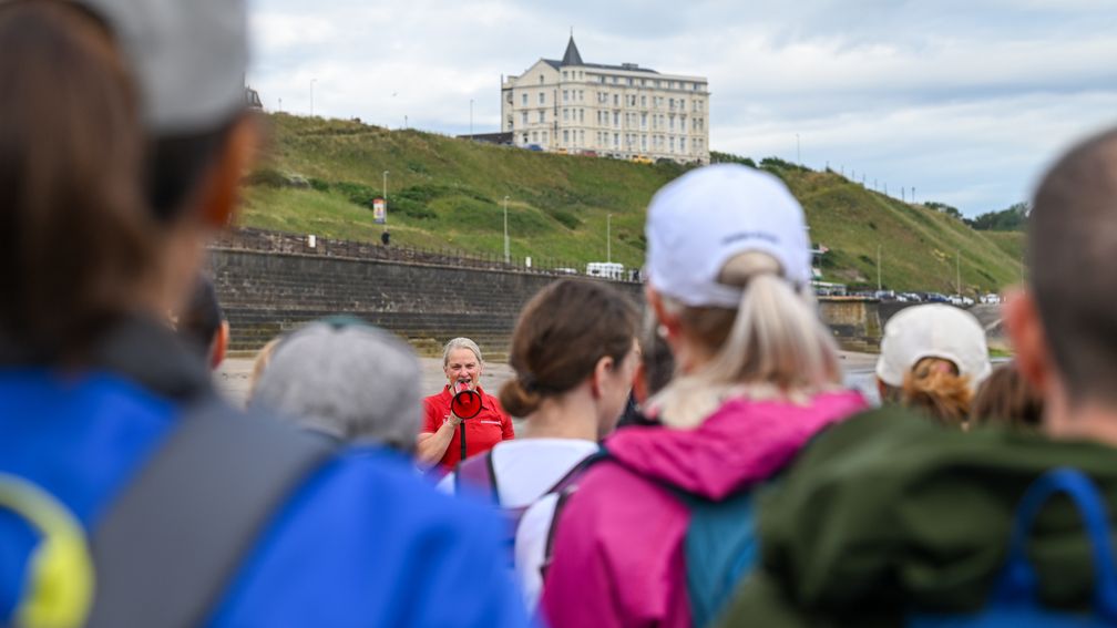 Dawn Goodfellow addresses the participants of a fundraising walk