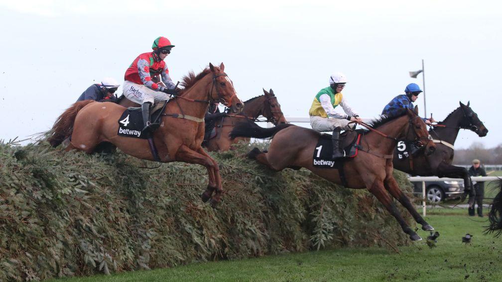 Warriors Tale (second right) clears a fence en route to victory in the Grand Sefton