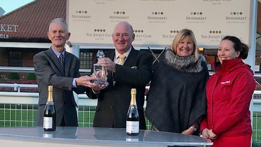 Dave Goodwin (left) presents the prize for the winners of the Jean Bucknell A Lifetime In Racing Nursery handicap Stakes