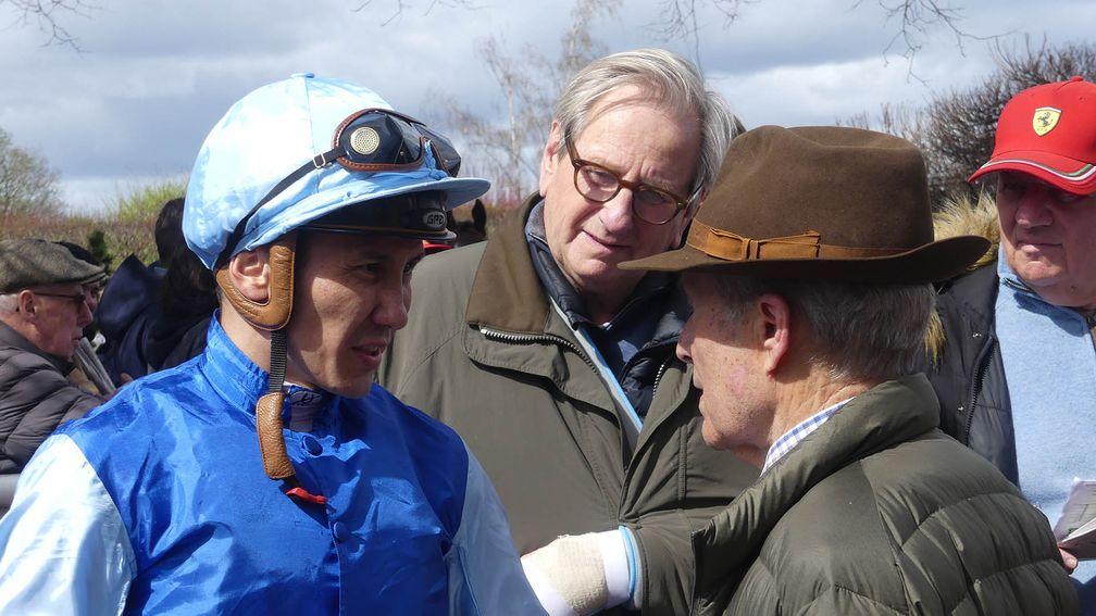 Bauyrzhan Murzabayev debriefs Andre Fabre and Anthony Stroud after the G3 Prix Penelope. 