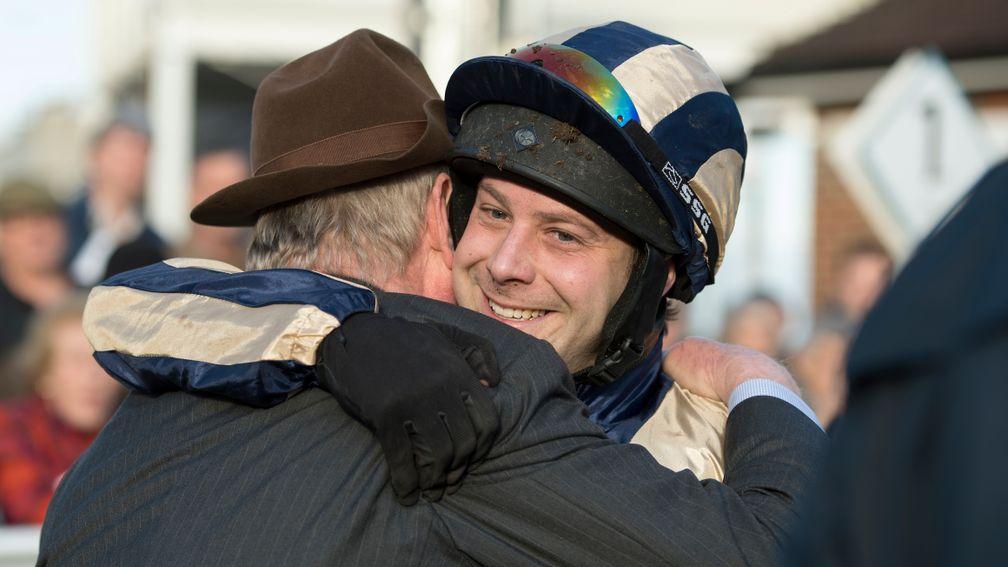 Captain Guy Disney hugs his dad Dr John Disney after an emotional victory in the Royal Artillery Gold Cup