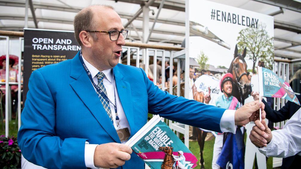 BHA chief executive, Nick Rust, hands out Enable flags to racegoersYork 22.8.19 Pic: Edward Whitaker