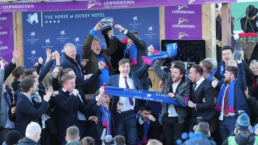 Members of the Niccolai Schuster Horse Racign Club celebrate an emotional victory