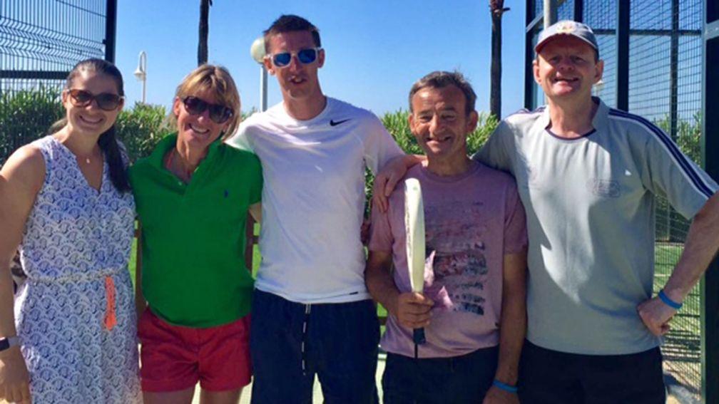 Fun in the sun: Georgie Baker, Jo Foster, George Baker, David ‘Mouse’ Cooper and Michael Caulfield are all smiles after a day of tennis while on the IJF beneficiaries holiday