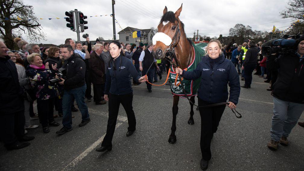 Grand National hero Tiger Roll, led by Karen Morgan (left) and Louise Dunne, is welcomed home by the village of Summerhill