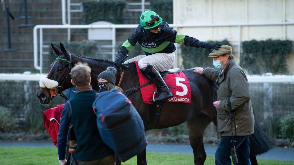 First Flow (David Bass) gives trainer Kim Bailey a pat on the head after the Clarence House ChaseAscot 23.1..21 Pic: Edward Whitaker/Racing Post