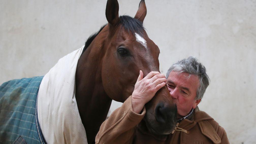 Loved up: Nigel Twiston-Davies plants a kiss on The New One