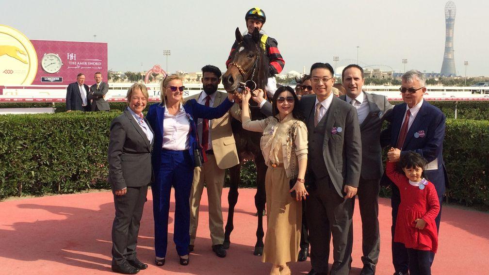 Global Spectrum surrounded by connections after winning the Al Biddah Mile at Al Rayyan