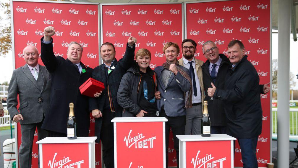 Owners Mark Scott (second left) and Carl Hinchy (third left) celebrate after Riders Onthe Storm's victory