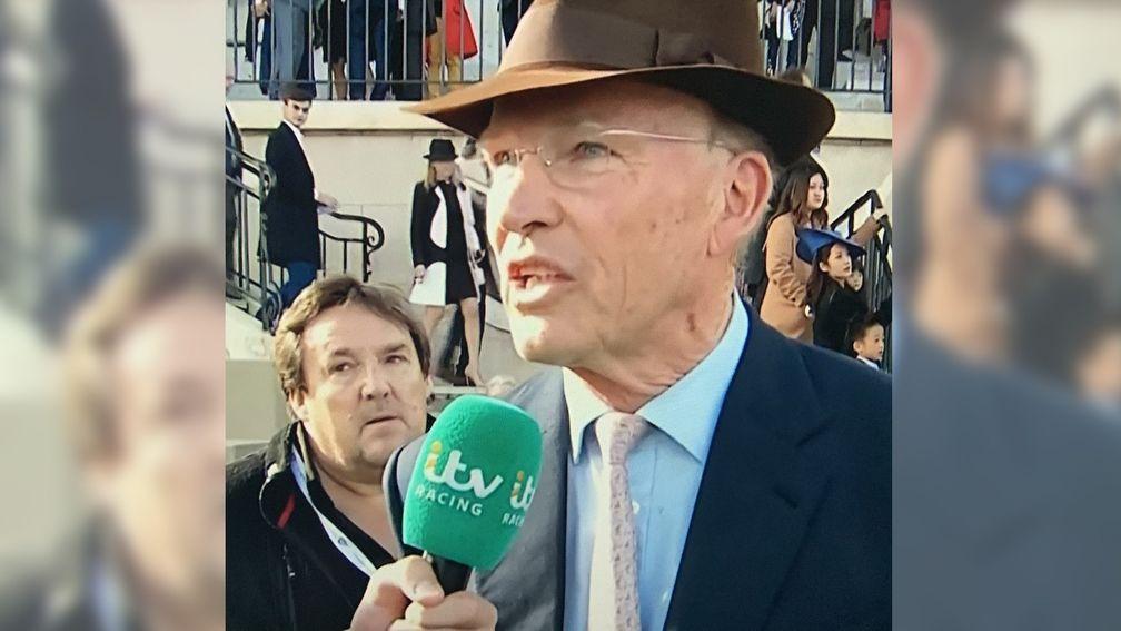 Richard Melia appeared in the background behind John Gosden at Longchamp on ITV