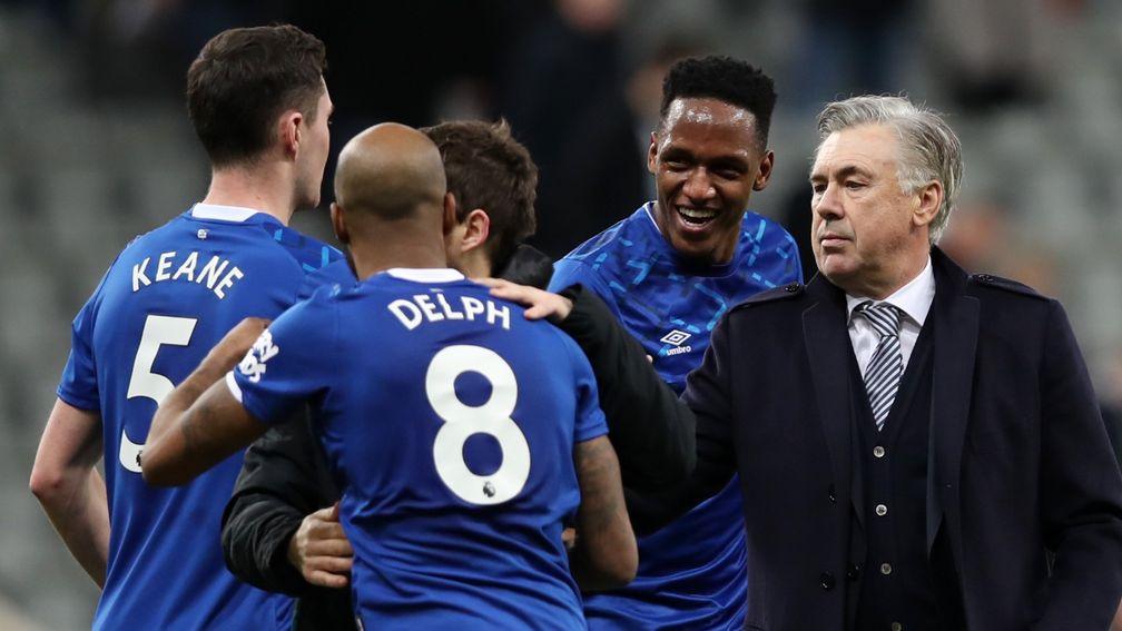 Carlo Ancelotti celebrates with Fabian Delph, Michael Keane and Yerry Mina of Everton