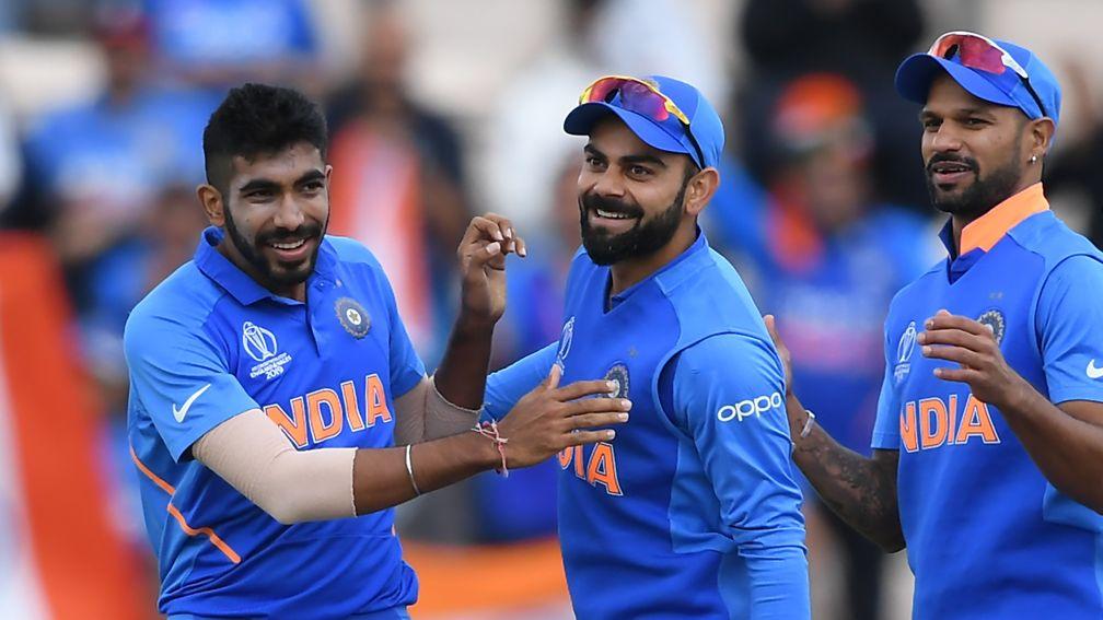 Jasprit Bumrah (left) celebrates the wicket of Quinton de Kock in India's win