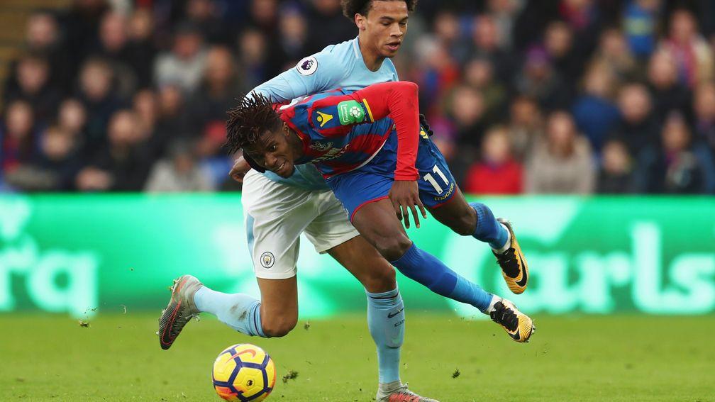Wilfried Zaha with Leroy Sane during Crystal Palace's draw with Manchester City
