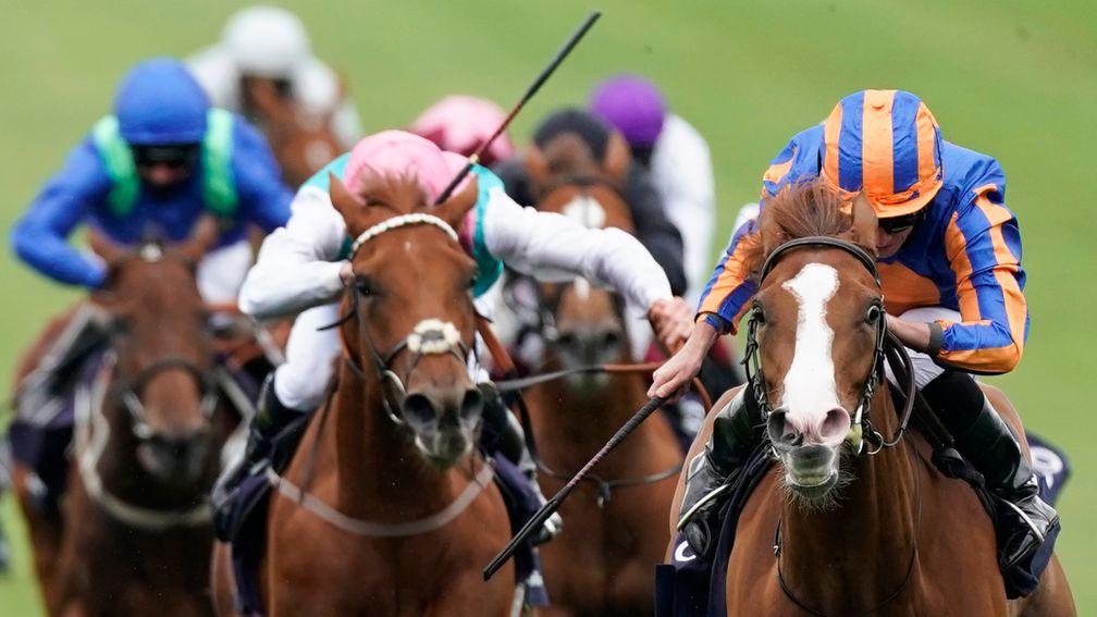 NEWMARKET, ENGLAND - JUNE 07: Ryan Moore riding Love (R, blue/orange) win The Qipco 1000 Guineas Stakes at Newmarket Racecourse on June 07, 2020 in Newmarket, England. (Photo by Alan Crowhurst/Getty Images)
