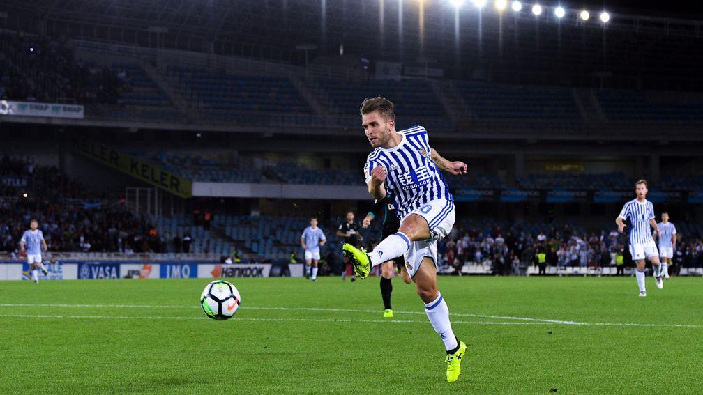 Kevin Rodrigues of Real Sociedad takes a shot against Real Madrid