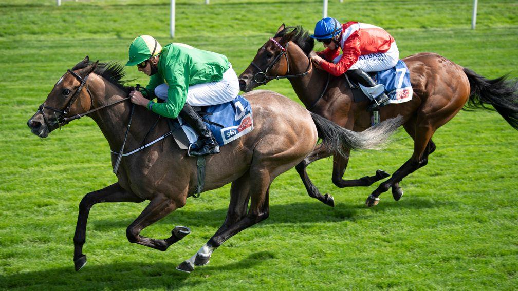 Miss Amulet (left) gets the better of Sacred in the Lowther Stakes at York
