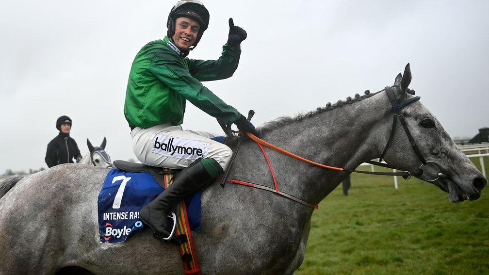 A delighted JJ Slevin poses for the cameras after Intense Raffles landed the Irish Grand National