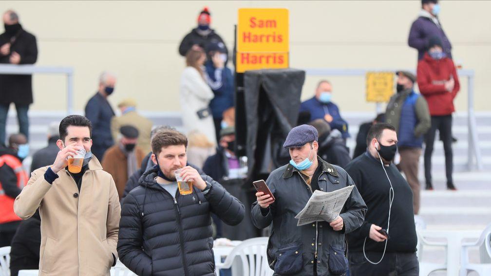 Racegoers at Lingfield enjoy a drink on course