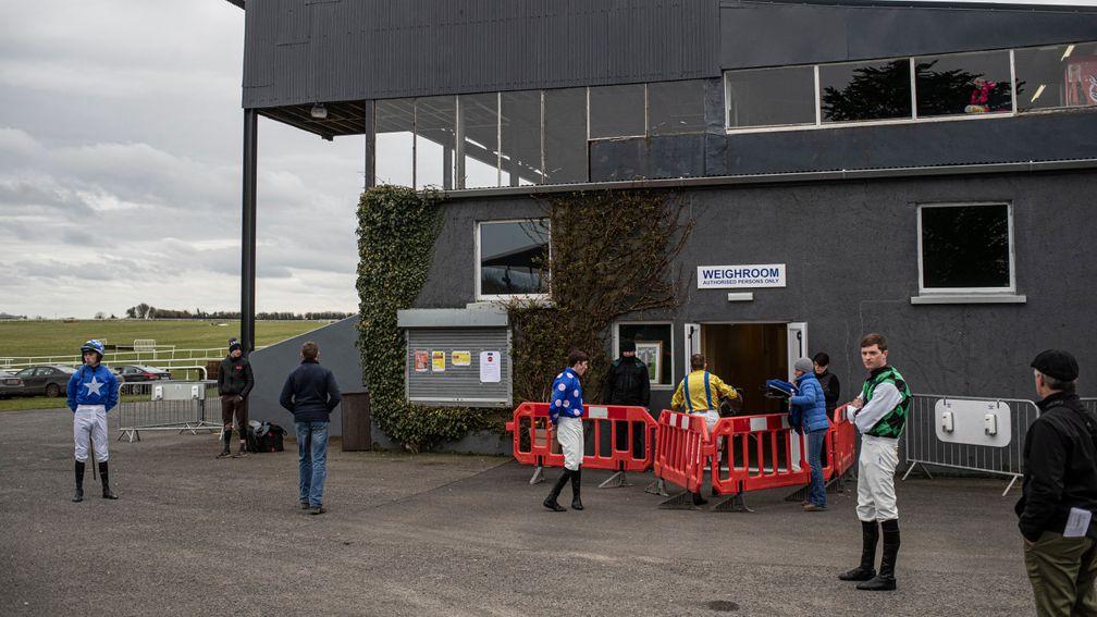 Jockeys wait to be called to weigh out for the opener.Thurles.Photo: Patrick McCann/Racing Post 21.03.2020