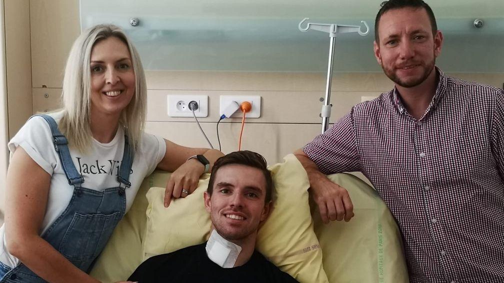 Jacob Pritchard Webb with mum Kelly and dad Matt by his bedside in a Paris hospital following a fall at Auteuil