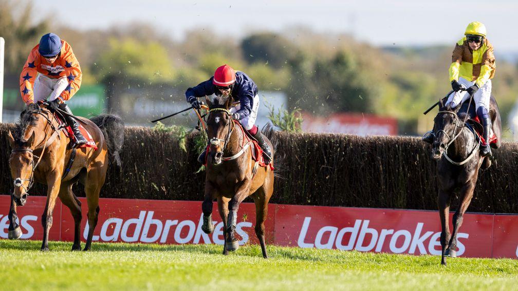 Fastorslow (centre) takes on Bravemansgame (left) and Galopin Des Champs (right) over the last in the Punchestown Gold Cup