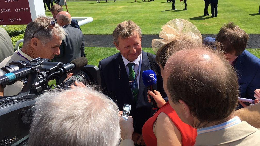 Mark Johnston is surrounded by the media after Dark Vision's win