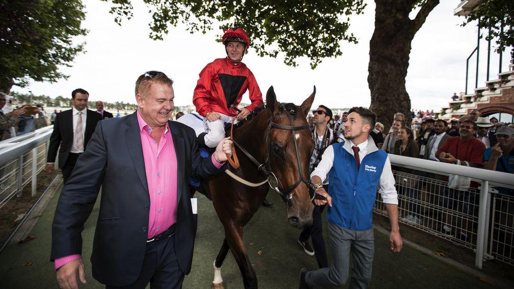All smiles: delighted owner John Laughton leads in Unfortunately after his colt landed the Prix Morny