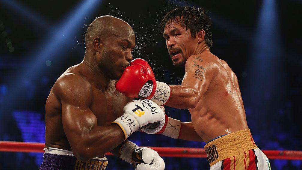 Manny Pacquiao (right) lands a left to the chin of Tim Bradley