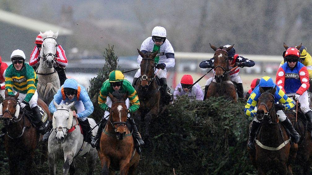 Pineau De Re (Leighton Aspell, white cap, centre) jumps The Chair on the way to Grand National glory
