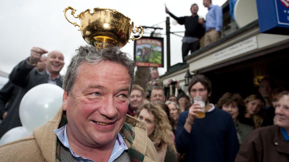Now where did I out that Gold Cup?: Nigel Twiston-Davies is in celebratory mode outside 'The Hollow' after Imperial Commander's finest hour