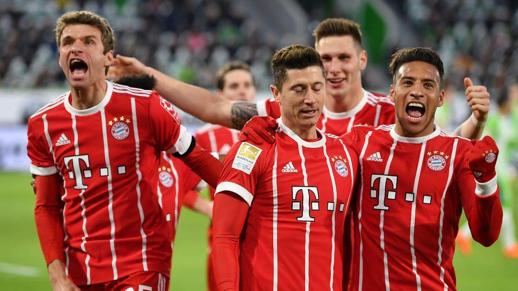 Bayern Munich celebrate Robert Lewandowski's winner at Wolfsburg on Saturday