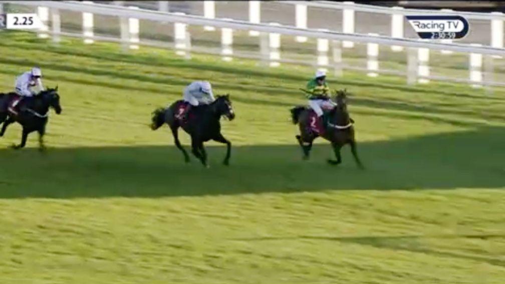 Champ and Barry Geraghty (right) narrowly avoid running out at the elbow on the Newbury run-in (Racing TV)