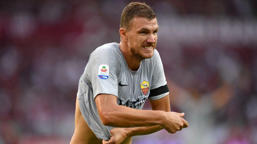 Ace Bosbnia striker Edin Dzeko celebrates a goal for Roma
