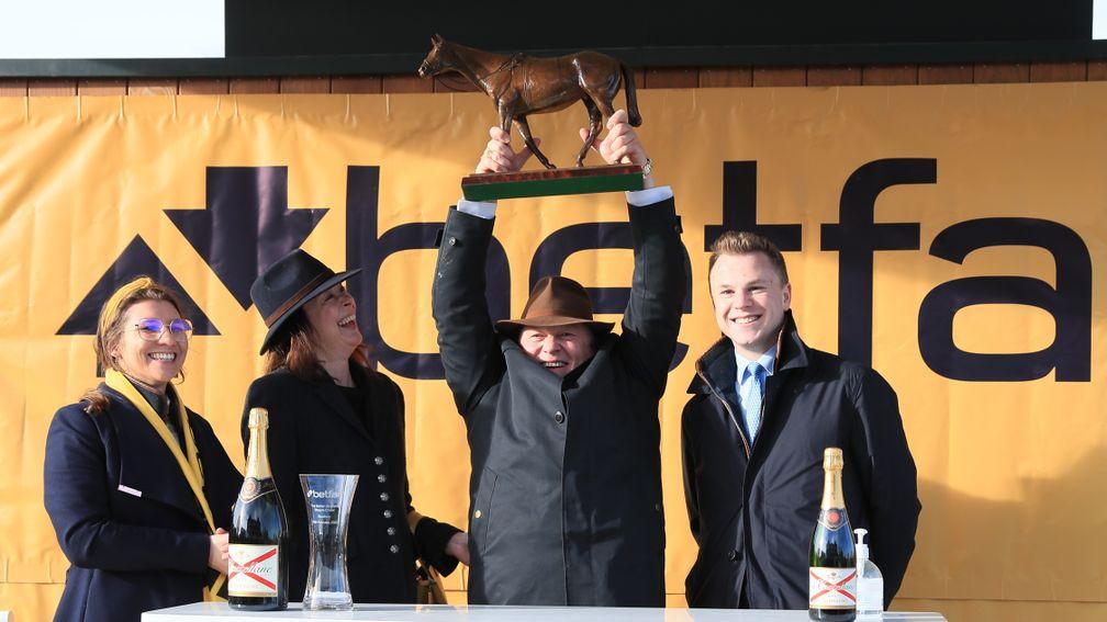 John Romans with the winning prize after the Denman Chase