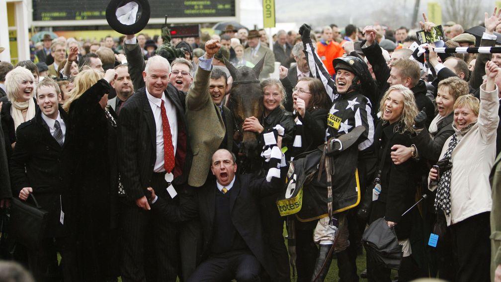 Past glories: Fergal O'Brien (front) and Paddy Brennan (black and white) lead the celebrations after Imperial Commander's 2010 Gold Cup success