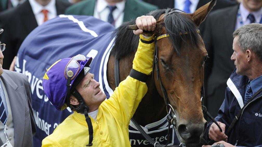 Mick Kinane alongside Sea The Stars following their Investec Derby triumph in 2009