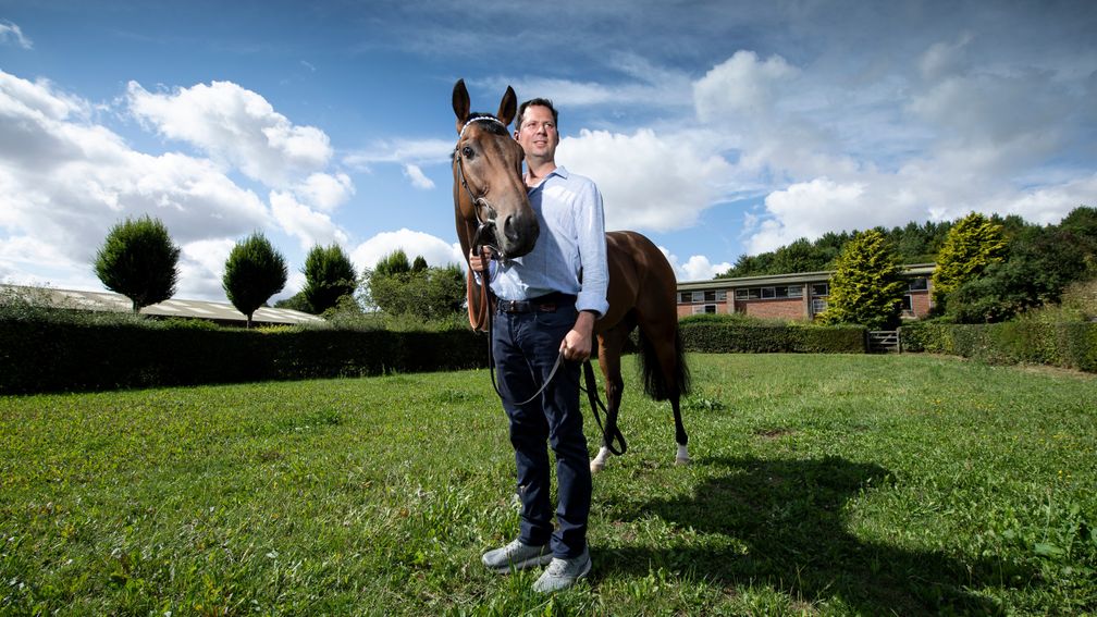 Battaash and Charlie Hills enjoy a relaxing moment in the sunshine at home