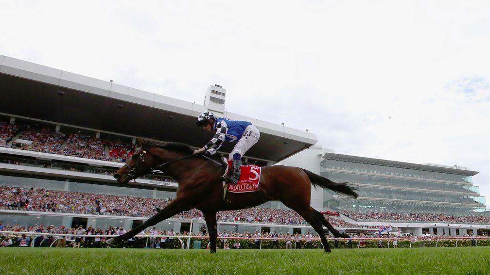 MELBOURNE, AUSTRALIA - NOVEMBER 04:  Ryan Moore rides Protectionist to win the Emirates Melbourne Cup on Melbourne Cup Day at Flemington Racecourse on November 4, 2014 in Melbourne, Australia.  (Photo by Robert Cianflone/Getty Images)