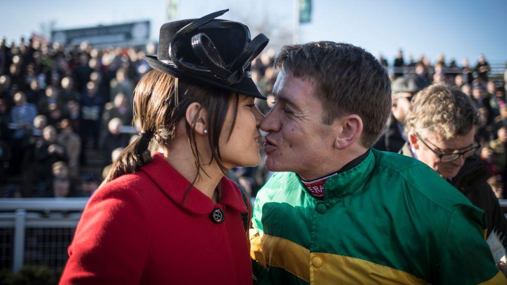 Geraghty's triumph is sealed with a kiss from wife Paula