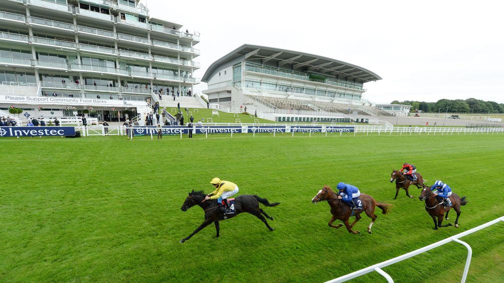 EPSOM, ENGLAND - JULY 04: Twaasol and jockey Martin Harley wins the Investec Woodcote EBF Stakes at Epsom Racecourse on July 04, 2020 in Epsom, England. The famous race meeting will be held behind closed doors for the first time due to the coronavirus pan