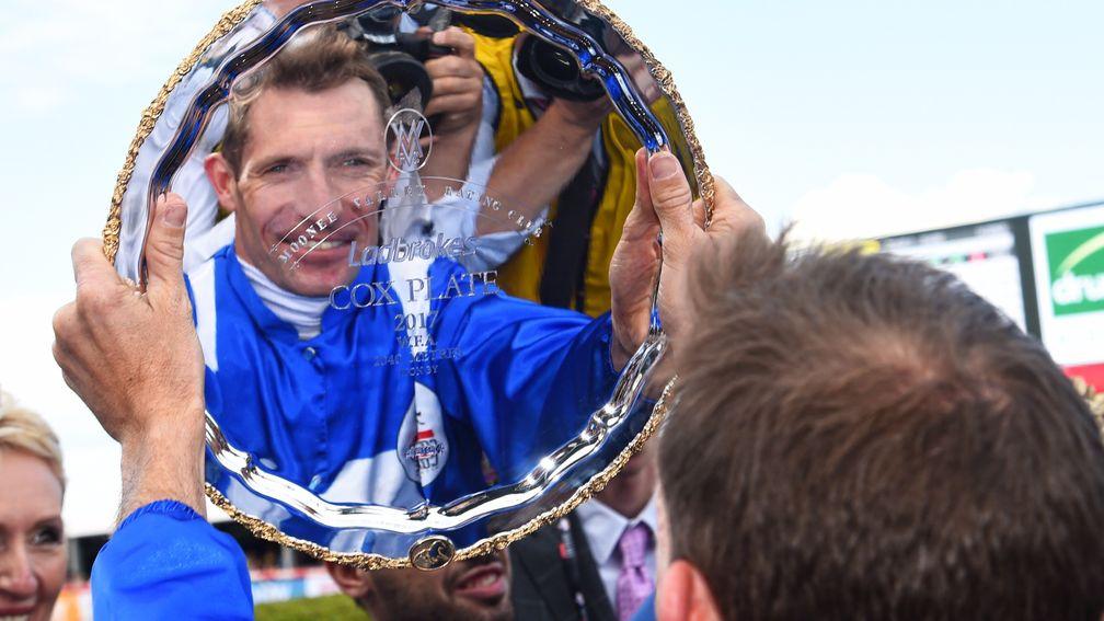 MELBOURNE, AUSTRALIA - OCTOBER 28:  Hugh Bowman poses with the plate after riding Winx to win Race 9, Ladbrokes Cox Plate  during Cox Plate Day at Moonee Valley Racecourse on October 28, 2017 in Melbourne, Australia.  (Photo by Vince Caligiuri/Getty Image