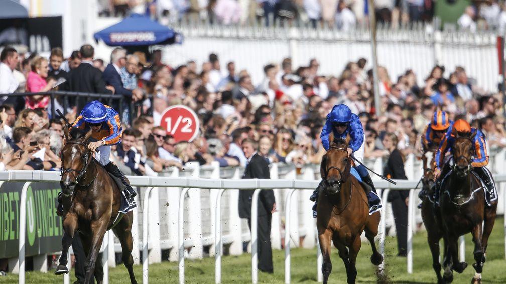 Wild Illusion (blue silks) chases home Forever Together in the Investec Oaks