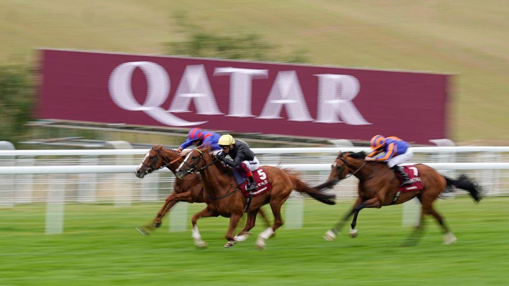 Stradivarius (Frankie Dettori) wins his fourth Goodwood Cup in a row as he quickens past Nayef Road with Santiago back in third