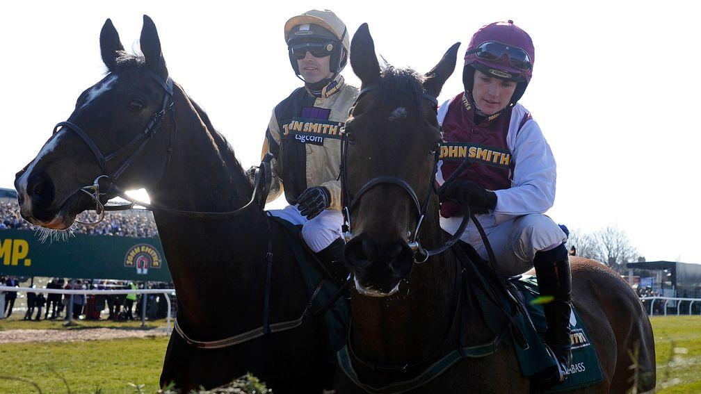 Ruby Walsh (left) on On His Own and Katie Walsh on Seabass inspect the first fence before the 2013 Grand National at Aintree