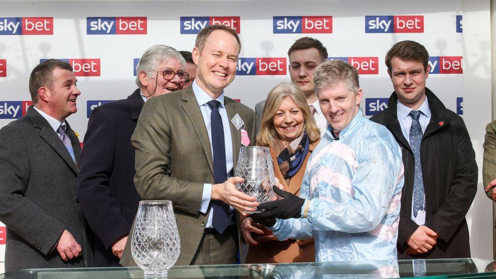 Sky Bet chief executive Richard Flint presents the trophies for this year's Supreme Novices' Hurdle