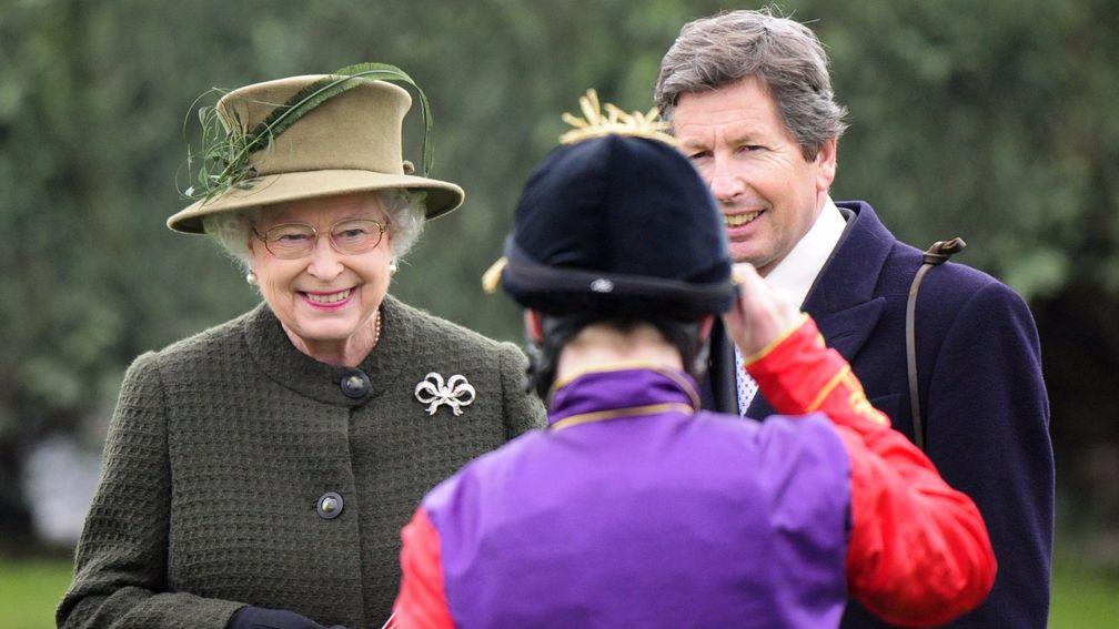John Warren (right) and the Queen greet jockey Jamie Spencer