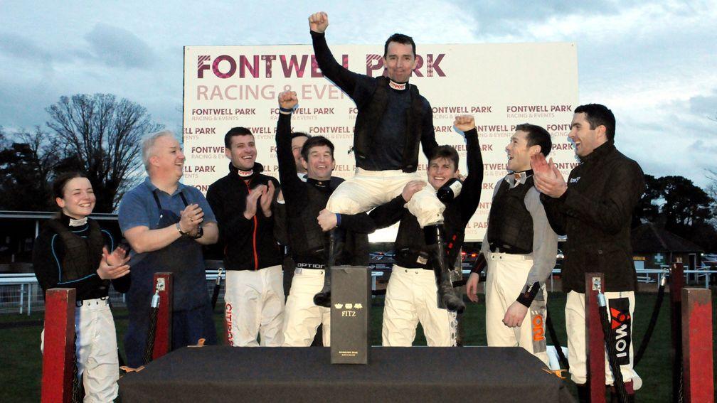 Leighton Aspell receives the cheers of his colleagues after his final ride at Fontwell