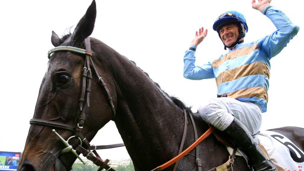 Davy Russell celebrates after steering Carriacou to Grand Steep' glory on his very first attempt at the Auteuil chase course