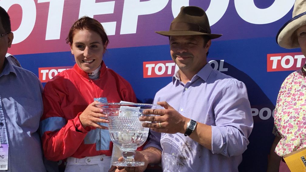Jockey Charlotte Jones and trainer Jimmy Moffatt celebrate Altruism's success